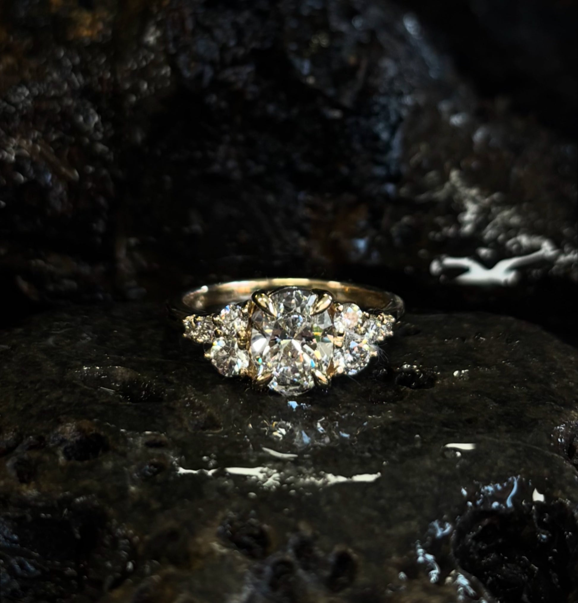 Multi stone Diamond ring on a textured black surface